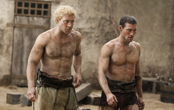 Jai Courtney and Andy Whitfield in Spartacus: Blood And Sand