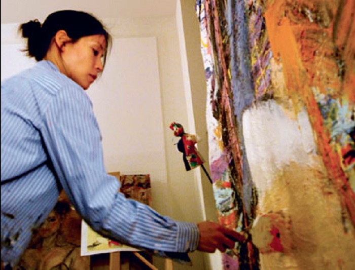 actress-lucy-liu-is-shown-painting-in-her-studio-in-this-2007